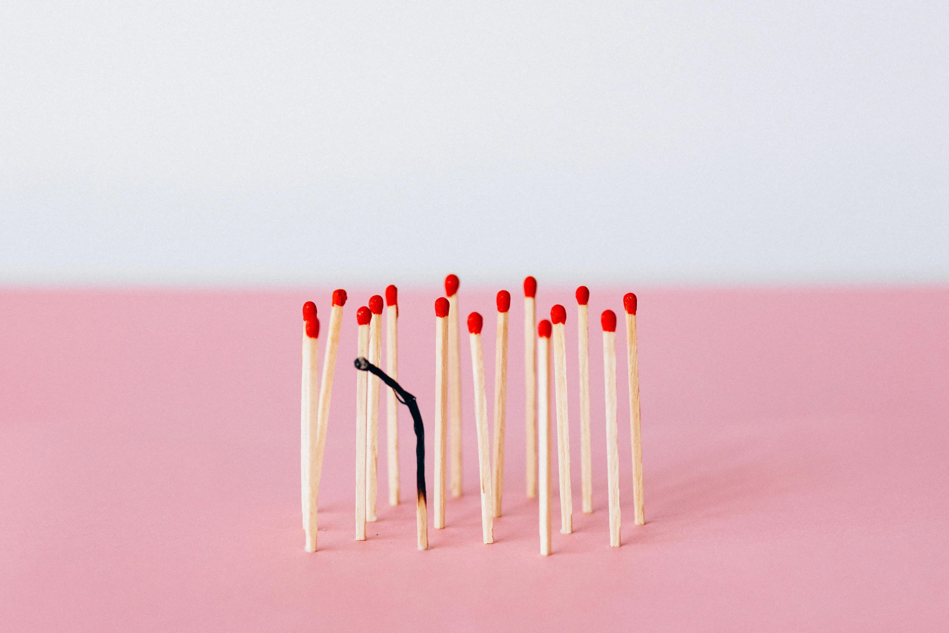 One burned match in a group of matches